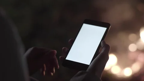 Phone screen glowing in the dark